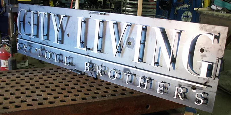 Custom metal business signs from Remtex laser cutting services